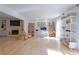 Sun-filled living room with hardwood floors, a fireplace, and built-in bookshelves, plus a home office area at 3811 Valley Green Dr, Marietta, GA 30068