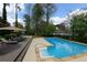 Relaxing pool view with lounge chairs and umbrellas on the wooden deck for outdoor comfort and leisure at 3811 Valley Green Dr, Marietta, GA 30068