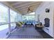 Relaxing screened-in porch with wicker seating, a ceiling fan, and garden view at 3811 Valley Green Dr, Marietta, GA 30068
