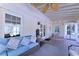 Charming screened-in porch with wicker furniture, a ceiling fan, and a water feature at 3811 Valley Green Dr, Marietta, GA 30068