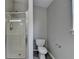 Bathroom featuring a modern walk-in shower and white toilet at 2274 Stancrest Ln, Lawrenceville, GA 30044