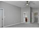 A bright bedroom featuring an ensuite bathroom entrance and a ceiling fan at 2274 Stancrest Ln, Lawrenceville, GA 30044