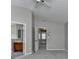 A primary bedroom featuring an ensuite bathroom entrance and a ceiling fan at 2274 Stancrest Ln, Lawrenceville, GA 30044