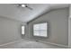 Vaulted ceiling bedroom with carpet, a ceiling fan, and natural light from a window at 2274 Stancrest Ln, Lawrenceville, GA 30044
