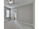 Neutral bedroom with a ceiling fan and a window offering natural light at 2274 Stancrest Ln, Lawrenceville, GA 30044