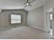 A bright and airy bedroom with large windows and a ceiling fan at 2274 Stancrest Ln, Lawrenceville, GA 30044