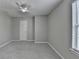 Bedroom with a window providing natural light and a ceiling fan at 2274 Stancrest Ln, Lawrenceville, GA 30044