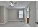 Carpeted bedroom featuring a window and a glimpse into the bathroom at 2274 Stancrest Ln, Lawrenceville, GA 30044