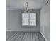 Bright dining area with a chandelier fixture and open view into the kitchen at 2274 Stancrest Ln, Lawrenceville, GA 30044