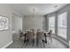 Dining area provides ample space with a modern chandelier, views to the exterior, and room to gather at 2274 Stancrest Ln, Lawrenceville, GA 30044