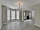 Dining area with modern chandelier and views to adjacent room with fireplace provides an inviting ambiance at 2274 Stancrest Ln, Lawrenceville, GA 30044