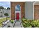 Close up of the front exterior showing an arched window above the red front door at 2274 Stancrest Ln, Lawrenceville, GA 30044