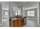 This updated kitchen includes a serving hatch, stainless appliances and new wood flooring at 2274 Stancrest Ln, Lawrenceville, GA 30044
