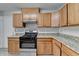 Kitchen features stainless steel appliances, granite countertops, and wood cabinets at 2274 Stancrest Ln, Lawrenceville, GA 30044