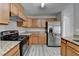 Updated kitchen features stainless steel appliances, granite countertops, and wood cabinets at 2274 Stancrest Ln, Lawrenceville, GA 30044