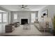 Staged living room with a fireplace, modern decor, and a comfortable seating area at 2274 Stancrest Ln, Lawrenceville, GA 30044