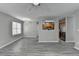 Bright living room with modern light fixture flows to a kitchen with sleek appliances and ample counter space at 2274 Stancrest Ln, Lawrenceville, GA 30044