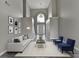 Bright living room boasts soaring ceilings, a grand chandelier, and elegant furnishings for a welcoming space at 2274 Stancrest Ln, Lawrenceville, GA 30044