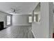 Bright living room with ceiling fan, new wood floors and a view of the kitchen at 2274 Stancrest Ln, Lawrenceville, GA 30044