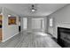 Bright, open living room with gray flooring, a ceiling fan, and a fireplace at 2274 Stancrest Ln, Lawrenceville, GA 30044