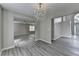 Open-concept design showcases a bright, airy space, new floors, and chandelier lighting, creating modern appeal at 2274 Stancrest Ln, Lawrenceville, GA 30044