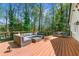 Outdoor deck featuring comfortable seating with a table and natural views at 292 Old Rosser Rd, Stone Mountain, GA 30087