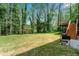 Lush green backyard featuring a grill and patio at 292 Old Rosser Rd, Stone Mountain, GA 30087
