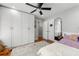 Bedroom with a ceiling fan, hardwood floors, and large closet space at 292 Old Rosser Rd, Stone Mountain, GA 30087