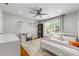 Bright bedroom featuring a ceiling fan, desk and large window at 292 Old Rosser Rd, Stone Mountain, GA 30087