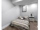 Simple bedroom showcasing a comfortable bed with patterned bedding and a bedside table at 292 Old Rosser Rd, Stone Mountain, GA 30087