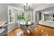 Cozy breakfast nook with bay window overlooking lush greenery, featuring modern lighting and hardwood floors at 292 Old Rosser Rd, Stone Mountain, GA 30087