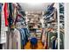 Spacious walk-in closet with custom shelving for shoes, clothing and accessories at 292 Old Rosser Rd, Stone Mountain, GA 30087