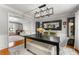 Stylish dining area with modern light fixture and views into an office and formal living room at 292 Old Rosser Rd, Stone Mountain, GA 30087