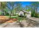 Charming home featuring a well-manicured lawn, mature trees, and an inviting driveway, perfect for suburban living at 292 Old Rosser Rd, Stone Mountain, GA 30087