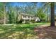 Traditional two-story home showcasing beautiful landscaping and well-manicured lawn at 292 Old Rosser Rd, Stone Mountain, GA 30087