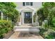 Elegant front entrance with classic details, manicured shrubs, and stylish lighting at 292 Old Rosser Rd, Stone Mountain, GA 30087