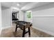 Spacious game room featuring a foosball table and doorway leading to basketball game at 292 Old Rosser Rd, Stone Mountain, GA 30087