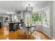 Charming kitchen with bay window, modern lighting, breakfast bar, and hardwood floors, great for Gathering meals at 292 Old Rosser Rd, Stone Mountain, GA 30087