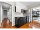 Modern kitchen featuring stainless steel appliances, light countertops and dark cabinets, and hardwood floors at 292 Old Rosser Rd, Stone Mountain, GA 30087