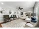 Elegant living room featuring hardwood floors, stylish seating, and decorative mirrors, perfect for entertaining at 292 Old Rosser Rd, Stone Mountain, GA 30087