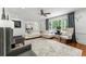 Bright, open living room with hardwood floors and large windows allowing natural light at 292 Old Rosser Rd, Stone Mountain, GA 30087