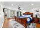 Spacious main bedroom featuring a king bed, hardwood floors, and natural light, perfect for relaxation at 292 Old Rosser Rd, Stone Mountain, GA 30087