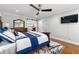 Comfortable main bedroom featuring a king bed, hardwood floors, and an ensuite bathroom, offering a serene retreat at 292 Old Rosser Rd, Stone Mountain, GA 30087
