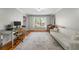 Home office with desk, sofa and large window allowing for plenty of natural light at 292 Old Rosser Rd, Stone Mountain, GA 30087