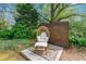 Charming outdoor space with a comfortable egg chair, accent rug, and lush greenery at 292 Old Rosser Rd, Stone Mountain, GA 30087