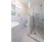 Bright bathroom featuring a glass shower and a white vanity with a pedestal sink at 139 W Paces Ferry Nw Rd, Atlanta, GA 30305