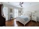 Comfortable bedroom with hardwood floors, a full bed, side tables, and a ceiling fan at 139 W Paces Ferry Nw Rd, Atlanta, GA 30305