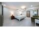 Bright bedroom with a queen bed, olive colored chair, and decorated armoire at 139 W Paces Ferry Nw Rd, Atlanta, GA 30305