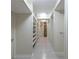 A view of a long, open closet space with floor-to-ceiling shelves on both sides, and light wood-look floors at 139 W Paces Ferry Nw Rd, Atlanta, GA 30305