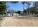 Expansive front lawn with a view of the home's exterior, showcasing its classic design and curb appeal at 139 W Paces Ferry Nw Rd, Atlanta, GA 30305
